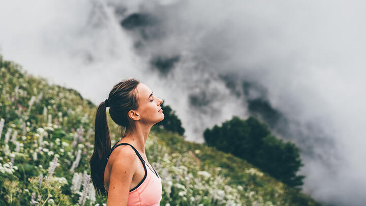 An athletic woman in beautiful, mountainous setting